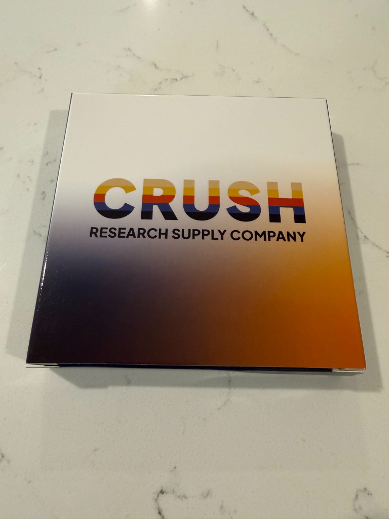 Crush Research peptides custom branded shipping box on a counter