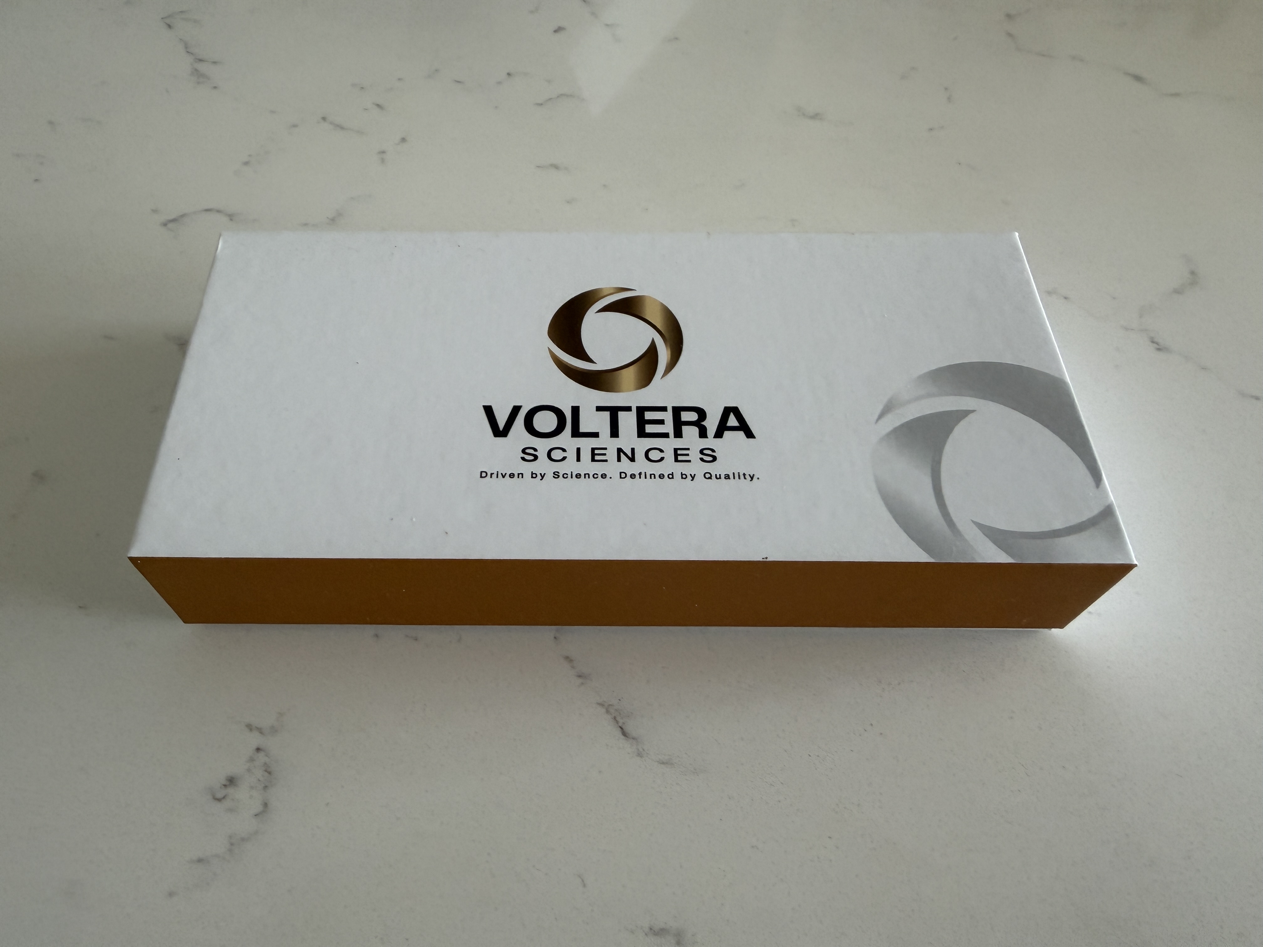 Angled view of the closed Voltera Sciences review package